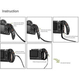 Instruction diagram for threading a camera hand strap through the camera
