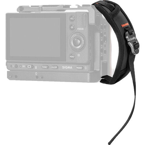 Black camera hand strap with wrist loop attached to a compact camera