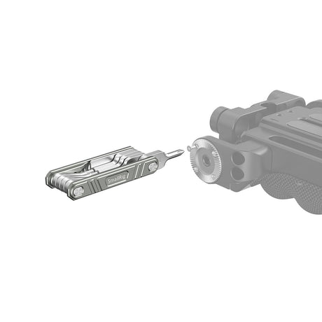 Screwdriver set accessory shown aligned with a camera handle mount, bits facing out