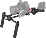 Shoulder rig for camera with two handgrips, long rails, and mounting platform