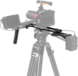 Shoulder support rig installed on camera with rails, handles, and mounting plates
