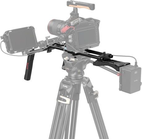 Shoulder support rig installed on camera with rails, handles, and mounting plates
