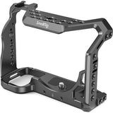 Camera cage frame with cutouts and multiple threaded ports, black anodized metal