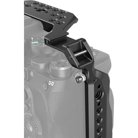 Close-up of camera cage top with mounting pattern and connector openings