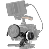Follow focus system on rig, focus ring at left with cable and side mount