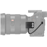 HDMI adapter on camera body with black bracket and attached cable