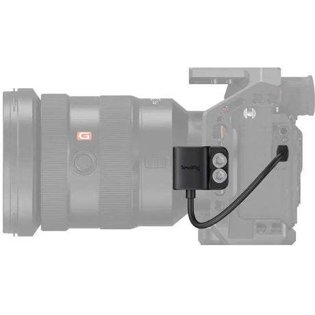 HDMI adapter on camera body with black bracket and attached cable