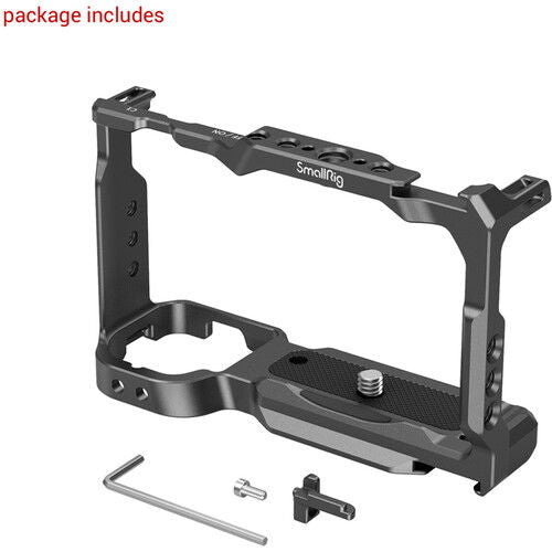 Black camera cage with accessories (mounting screws and Allen key) shown