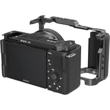 Sony ZV-E10 in camera cage with right-side handle grip, black metal and textured controller