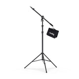 Pneumatic boom light stand with tripod base and hanging accessory bag