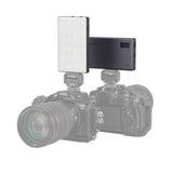 LED video light mounted on a camera rig with two light panels