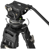 Close-up of fluid video head with adjustment knobs on black tripod