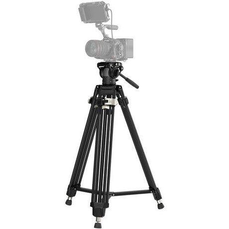 Black camera tripod with fluid head and long legs