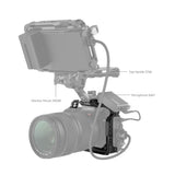 Camera cage with monitor mount and microphone mount, connected to top handle and cables