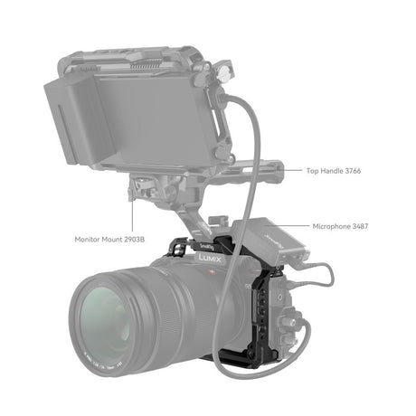 Camera cage with monitor mount and microphone mount, connected to top handle and cables