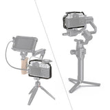 Camera cage for Fujifilm X-T4 with monitor, cables, and grip on tripod stand