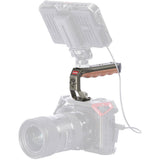 ARRI locating handle with wood grip and pin holes on camera rig