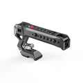 NATO top handle rig with red control button and multiple mounting holes, dark metal