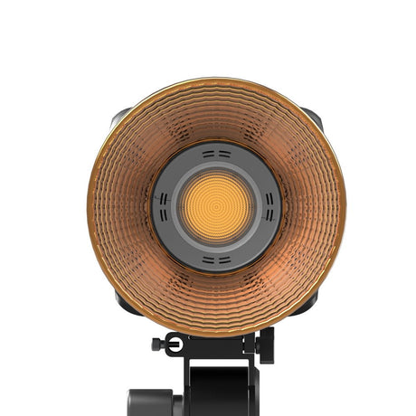 Bicolor COB video LED light, circular reflector and glowing central emitter