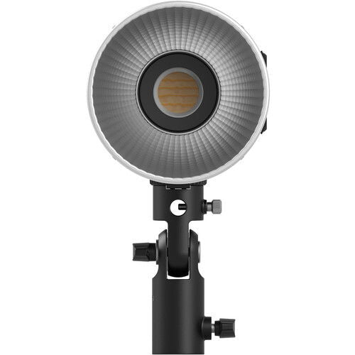 Front reflector grille of a bi-color LED video light on a black mounting stand