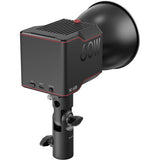 Bi-color LED video light with side ports and compact body, mounted on a handheld stand