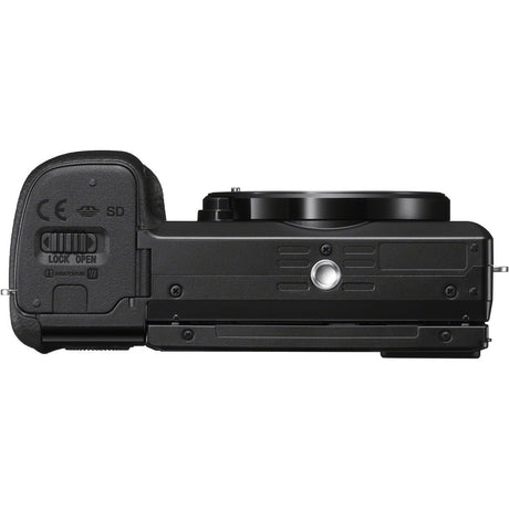 Black mirrorless camera underside view with compartment door and SD/lock labels