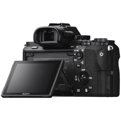 Mirrorless camera with LCD screen open and rear controls visible, side view