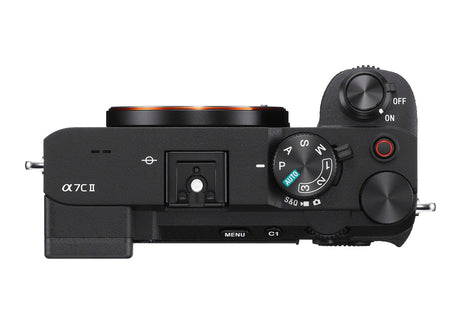 Mirrorless camera from side, control dial and shutter button visible