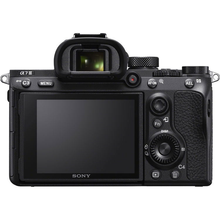Black mirrorless camera back view with LCD screen and control dials