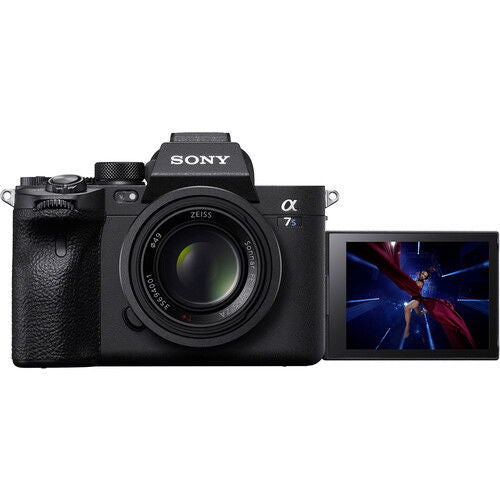 Black mirrorless camera with attached lens and side LCD display