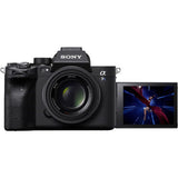 Black mirrorless camera with attached lens and side LCD display