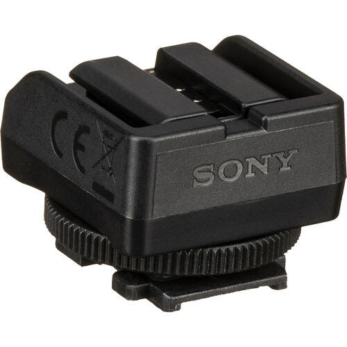 Black camera accessory adaptor with multi-pin contact opening
