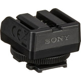 Black camera accessory adaptor with multi-pin contact opening