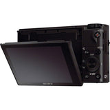 Compact camera back view with articulating LCD and visible control buttons.
