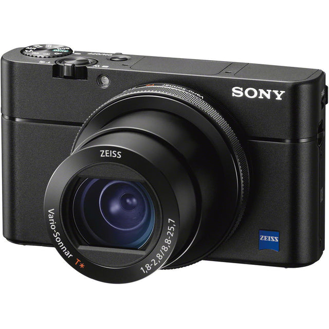 Black compact digital camera with large lens and top control dial