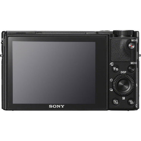 Rear view of black compact camera with LCD screen and control buttons