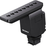 Digital mic with gray furry windscreen, black housing, and top mounting plate