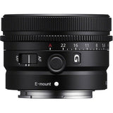 Black lens top view with E-mount label, mode switch, and aperture scale