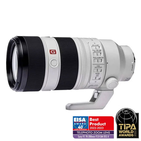White telephoto zoom lens with black focus ring and control dials, 70–200mm f/2.8