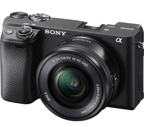 Mirrorless camera with 16-50mm kit lens, angled side view, black