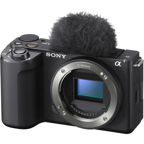 Black mirrorless camera body with furry top mic and visible lens mount