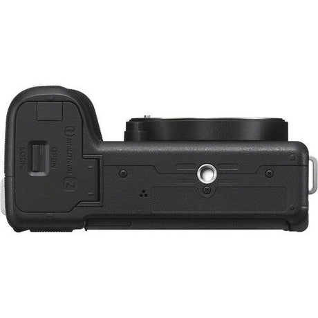 Black mirrorless camera body side showing textured grip and port cover