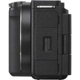 Black mirrorless camera body side with access door and textured grip