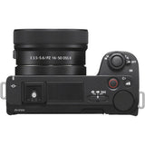 Black mirrorless camera with attached 16–50mm zoom lens, top controls visible