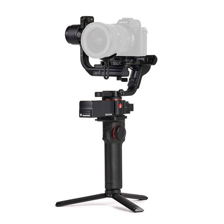 3-axis gimbal stabilizer with camera mounted, black body and three-leg base
