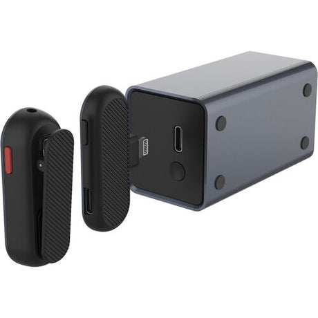 Wireless lavalier mic receiver and transmitter pods with visible ports, close angle