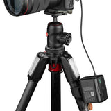 Battery bank on a tripod-mounted camera with connected cable and ports
