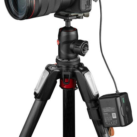 Battery bank on a tripod-mounted camera with connected cable and ports