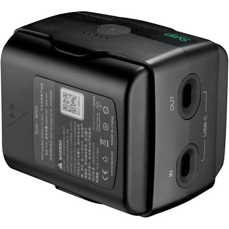 Black 5600mAh battery bank with label and output ports, close-up view