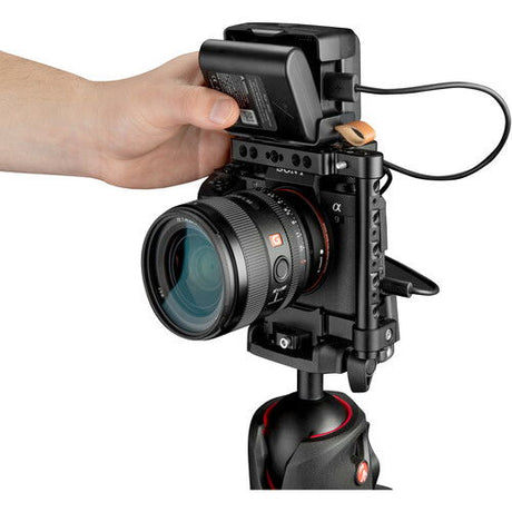 Battery pack mounted on a camera rig, showing power connection ports and cable